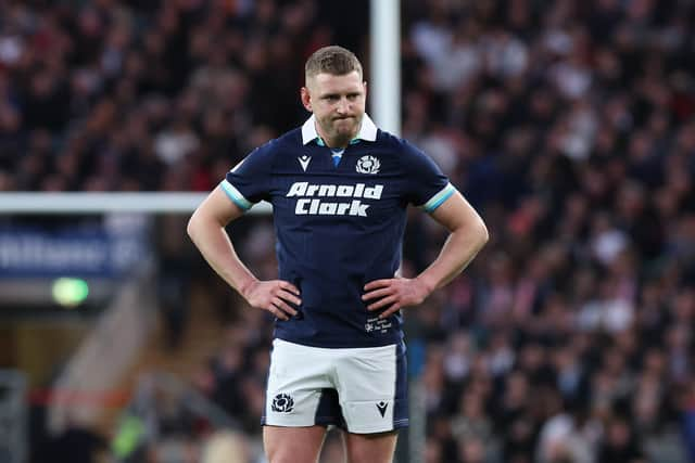 Finn Russell looks dejected during Scotland's defeat by England at Twickenham.